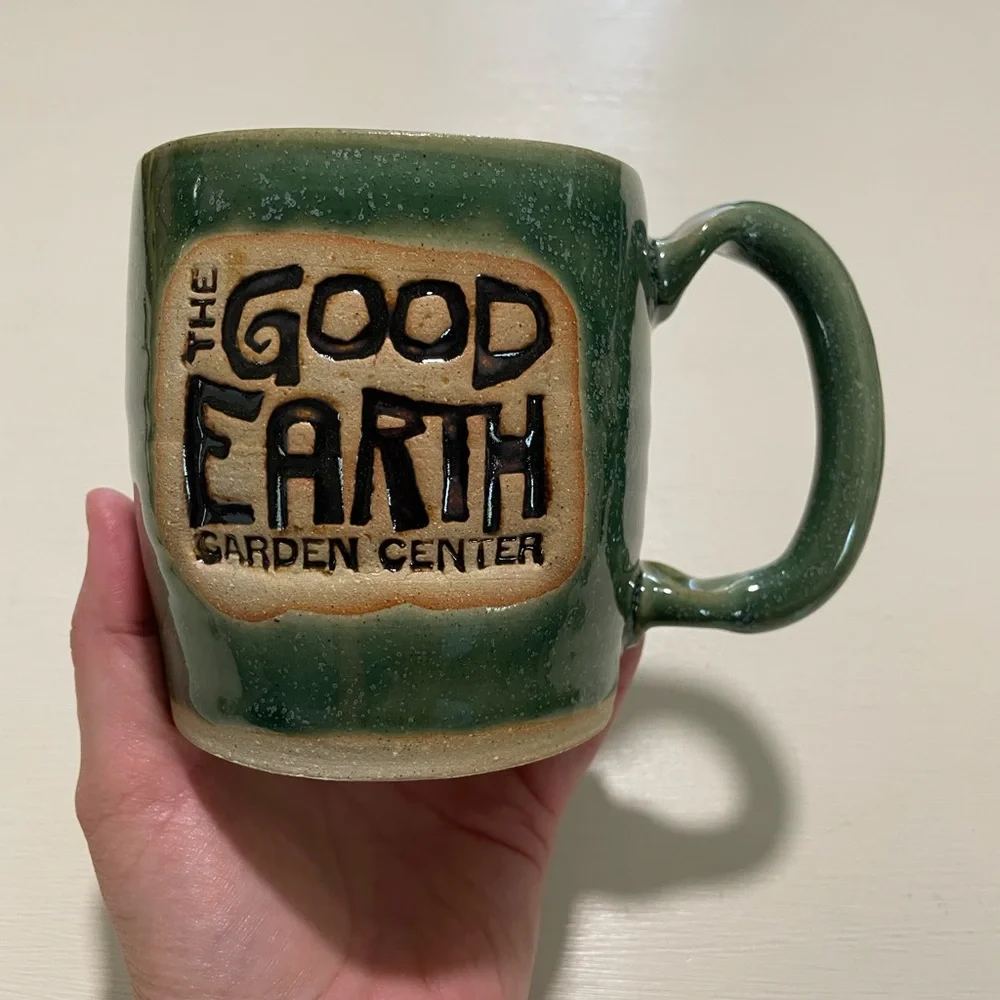 Good earth garden center‎ mug with crazy face